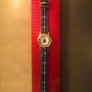 Christmas watch with blue/green plaid band.